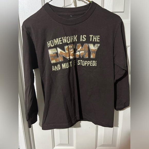 Boys T Shirt. Size XS. “Homework Is The Enemy And Must Be Stopped” - Picture 1 of 2